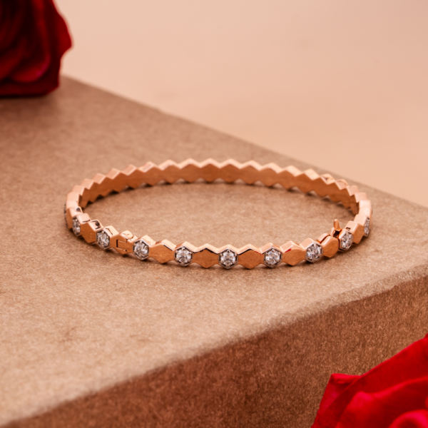 Faceted geometric bracelet with crystal detailing on neutral background