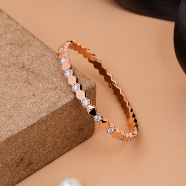 Faceted geometric bracelet with crystal detailing on neutral background