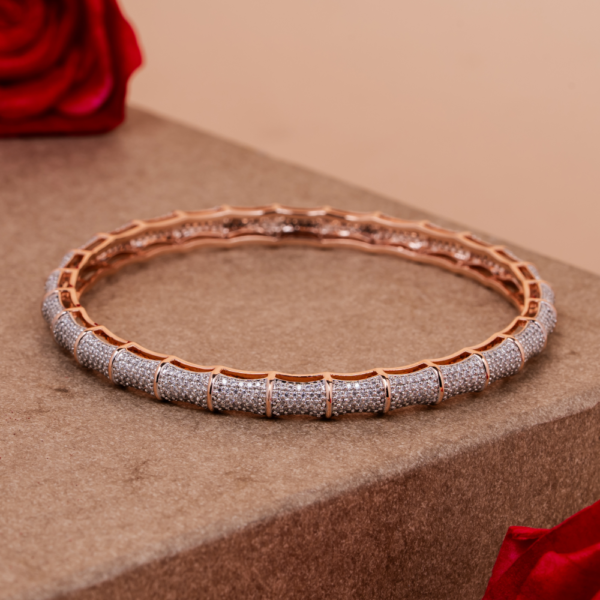 Luxurious pavé-set crystal bangle with geometric design on neutral background