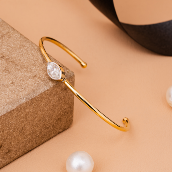 Minimal open bracelet with marquise-cut crystal centerpiece