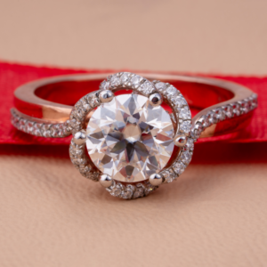 Rose gold ring featuring a round-cut diamond surrounded by a double halo of smaller diamonds for a radiant finish