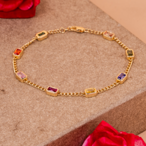 Yellow gold bracelet adorned with multicolored gemstones in a radiant pattern symbolizing vibrant luxury