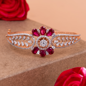 Exquisite rose gold bangle featuring blooming ruby petals and sparkling diamonds in a floral-inspired arrangement, radiating warmth and luxury